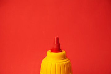 yellow mustard pot on color background