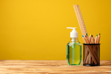 School stationery and hand sanitizer. Back to school concept while coronavirus pandemic