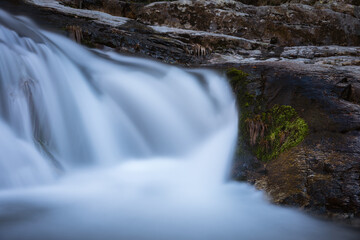 River water flows among the rocks and forms small waterfalls, Rascafría, Madrid, Spain