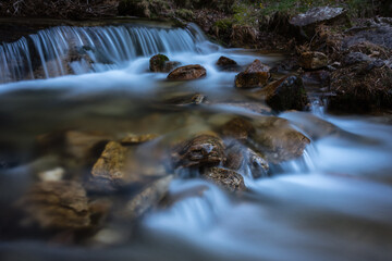 River water flows among the rocks and forms small waterfalls, Rascafría, Madrid, Spain