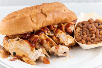 BBQ meal of chicken sandwich and baked beans will taste as delicious as it looks.