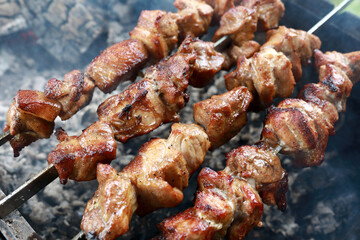 Roasting pork neck shashlik on charcoal