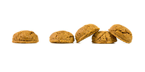 Fototapeta na wymiar Pepernoten bunch of traditional cookies in a row on white background