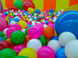 Fototapeta na wymiar Colorful balloon and plastic ball in the kids playground. 