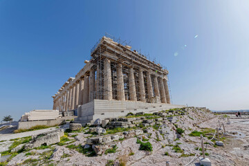 Parthenon the famous ancient Greek temple standing on Acropolis of Athens hill, impressive lens flare