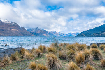 Lake Wakatipu in the mountains of Queenstown, New Zealand - 378751333