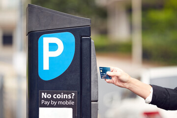 Close Up Of Businesswoman Making Contactless Payment For Car Parking At Machine With Card