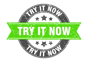 Obraz premium try it now round stamp with ribbon. label sign