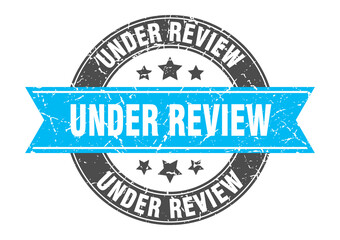 under review round stamp with ribbon. label sign