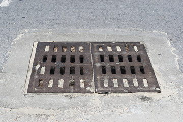 The big rectangle steel grille drainage cover is made of iron, mounted on the surface of the road.