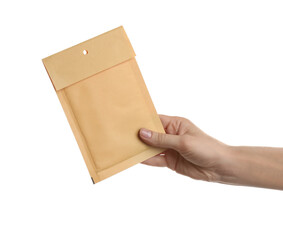 Woman holding kraft paper envelope on white background, closeup
