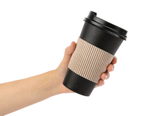 Woman holding takeaway paper coffee cup with cardboard sleeve on white background, closeup