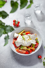 Burrata cheese with Basil leaves and tomatos. Caprese salad