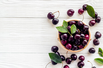 Sweet red cherries with leaves, flat lay, top view