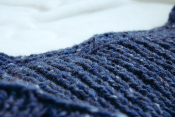 Texture beautiful knitted blue fabric as background. Copy space. Female hobby concept. Knitting