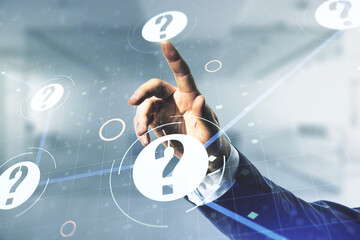 Man hand clicks on abstract virtual question mark hologram on blurred office background, future...
