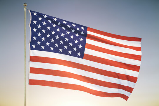 USA flag on sunset sky background