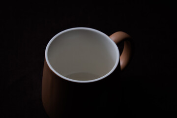 big cup of tea on a black background