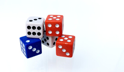 Red, white and blue colored dice isolated on white background