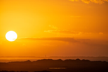 Sunrise in the beautiful protected nature area Het Oerd on the Wadden island of Ameland in the Netherlands, beautiful golden light in the early morning