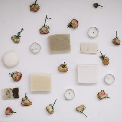 Floral composition. Soap with flowers on white background. Flat lay, top view mockup copy space template. Gift or present concept