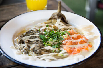 Traditional Arabic Mediterranean style, Eggplant Dish, with Tahini sauce and spicy peppers cream