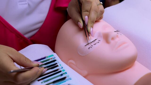 Eyelash extensions process on a mannequin model footage