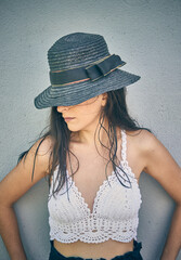 
A beautiful girl with a black hat and loose hair