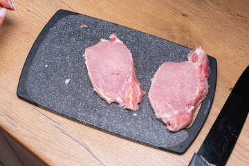 Fresh meat on chopping board. Juicy beef or pork meat