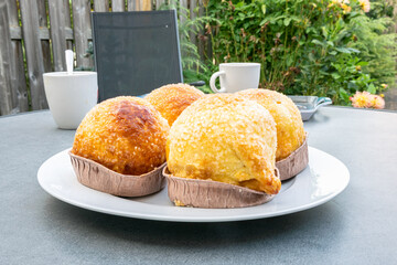 Homemade apple dumplings on a white plate. Baked according to Dutch recipe.