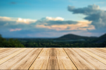 Showcase an old wooden table shelf on a beautiful sunset and blurred nature background.	