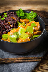 Thai red curry with chicken and black rice.