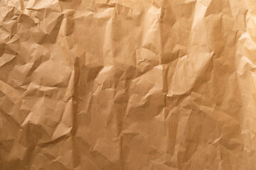 Kraft paper. Wrinkled craft paper. Craft cardboard texture background. Brown texture. 