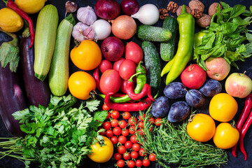 Fototapeta na wymiar Fresh vegetables and fruits background. Healthy organic food concept. Top view.