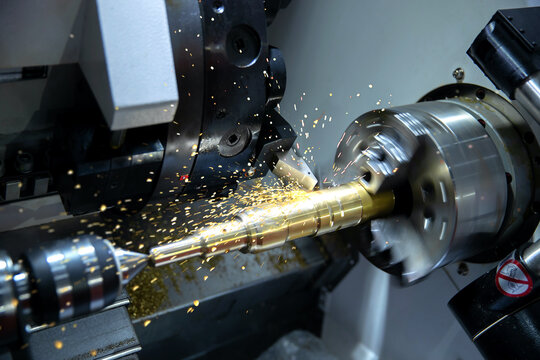 Metal machine tools industry. CNC turning machine high-speed cutting is operation.flying sparks of metalworking