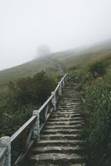 Fototapeta na wymiar Steps leading to house in fog on Wugong Mountain in Jiangxi, China