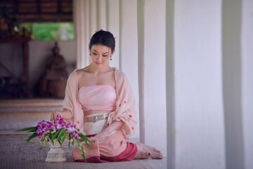 Thai Lanna women living in northern Thailand dressed in traditional Lanna clothes that are unique to Chiang Mai people.