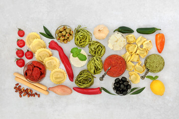Italian food for a healthy balanced diet with a selection of health foods high in antioxidants, anthocyanins, lycopene, protein, vitamins, fiber, omega 3, & minerals. Flat lay on mottled grey.