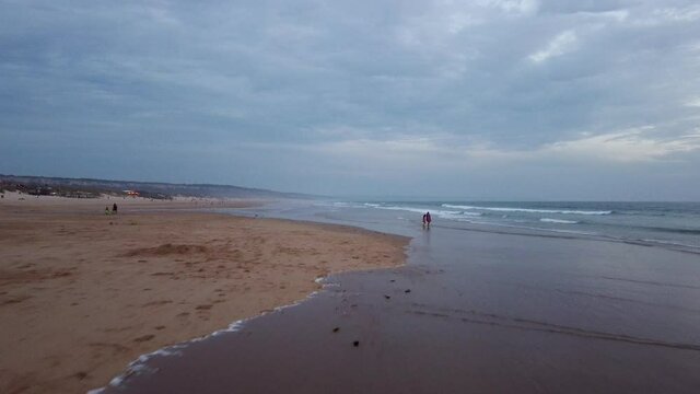 Aerial beach view above Costa de Caparica .Beautiful landscape shot by drone. Aerial of Portuguese beach near Lisbon at sunset. Ocean view.