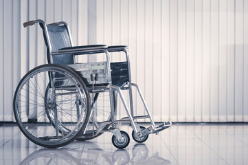 Fototapeta na wymiar Wheelchair for hospital patients. Selective focus