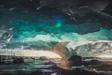 Panoramic shot of calypso ice cave under a glacier - obrazy, fototapety, plakaty