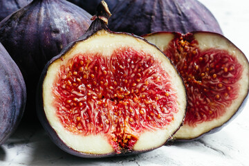 Ripe cut figs on a light background