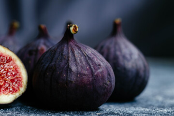 Ripe cut figs on a light background