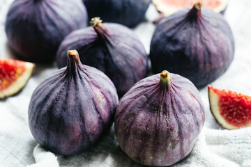 Ripe cut figs on a light background