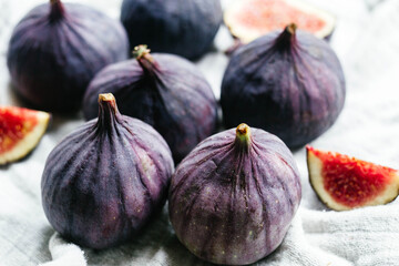 Ripe cut figs on a light background