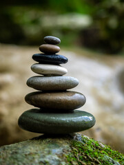 Fototapeta na wymiar Balanced Zen stones at the waterfalls