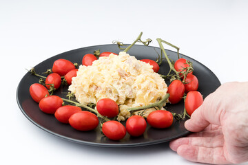 Russian salad. With red tomatoes, with white background.Spain