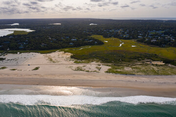 The cold water of the Atlantic Ocean washes onto the sandy beaches of Cape Cod, Massachusetts. This...