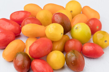 Tomatoes of different colors. On white background
