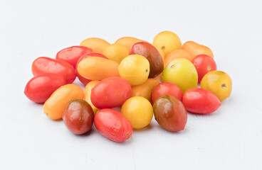 Tomatoes of different colors. On white background